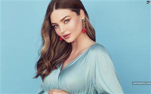 Miranda Kerr looks aesthetically pleasing in a cadet blue colour